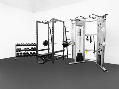 Gym equipment including a power rack, dumbbells, and a cable machine on a gray floor.